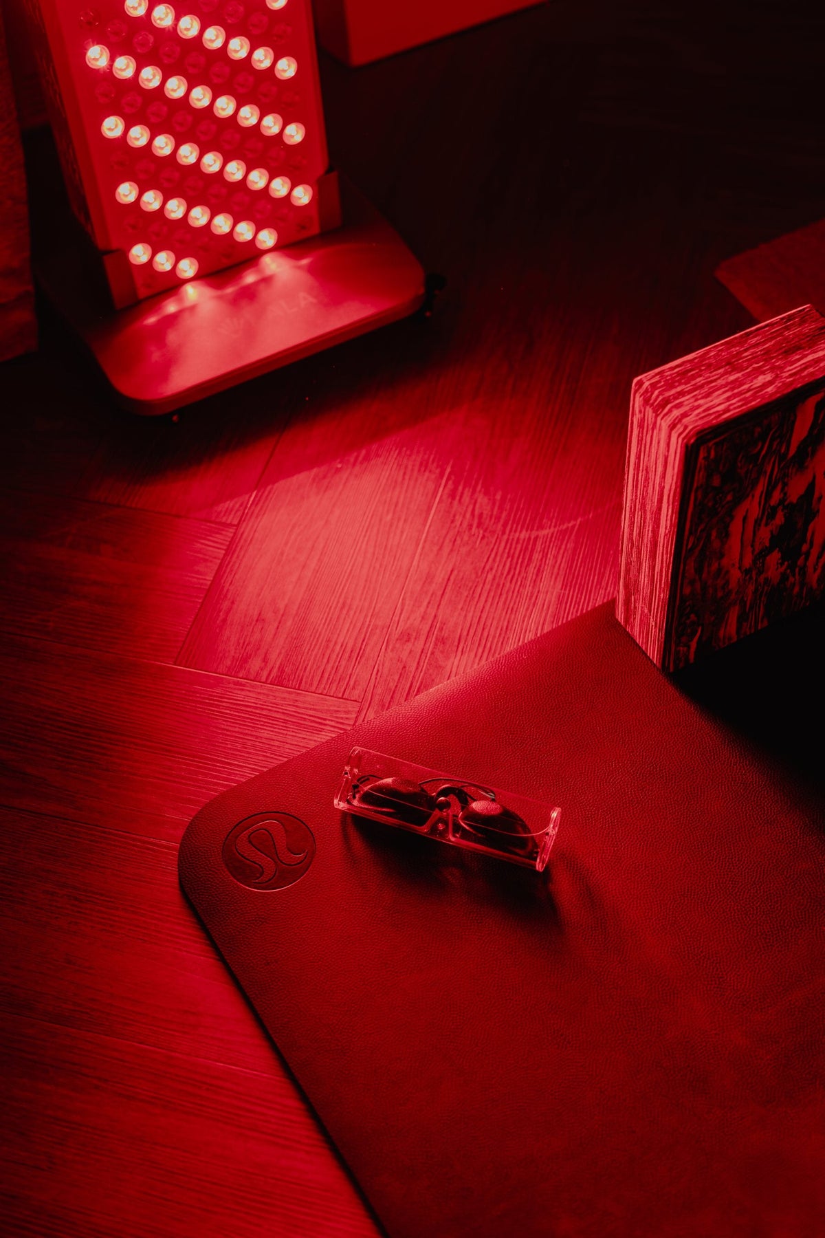 Kala Red Light Pro, protective goggles and yoga mat set up for a private session